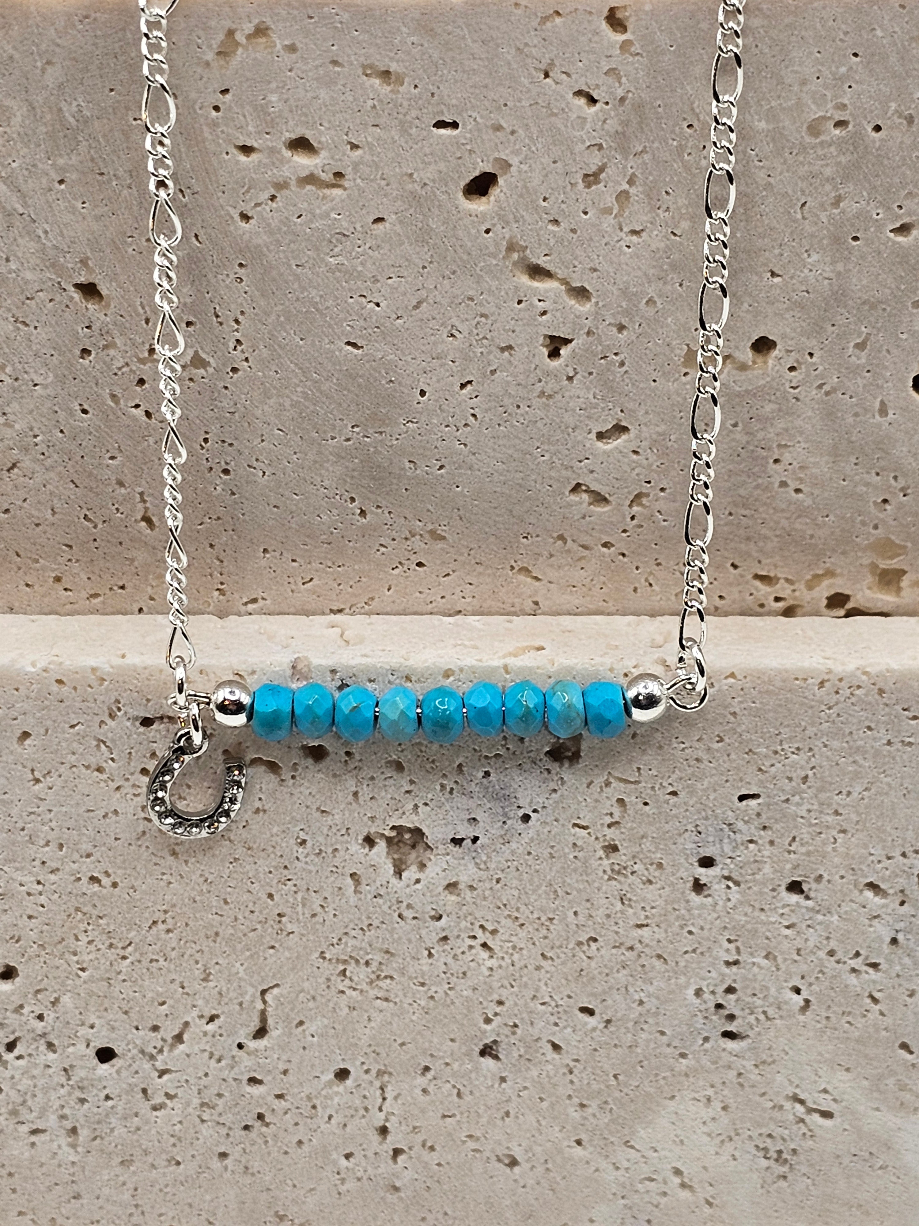 Howlite beaded silver necklace with a small horse shoe charm