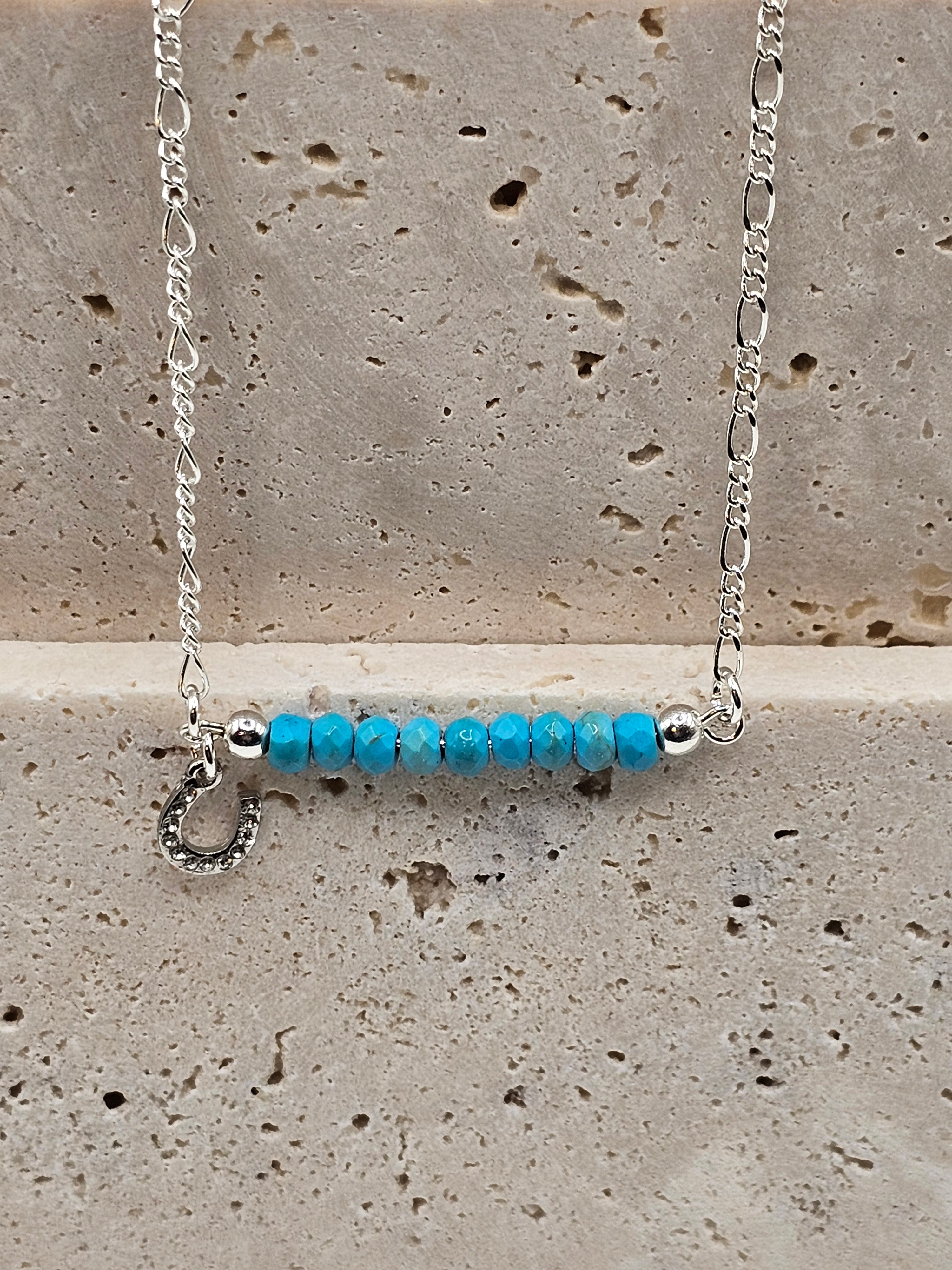 Howlite beaded silver necklace with a small horse shoe charm