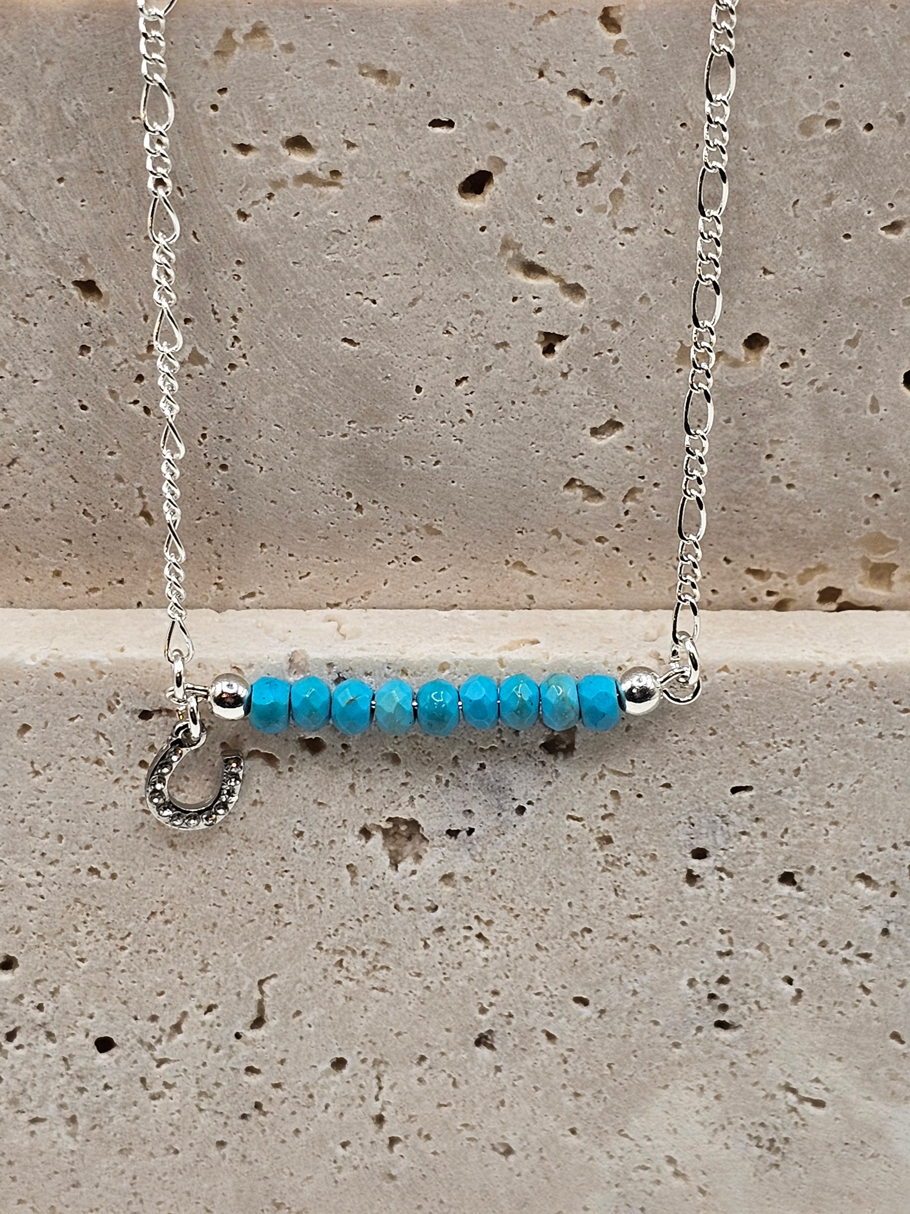 Howlite beaded silver necklace with a small horse shoe charm